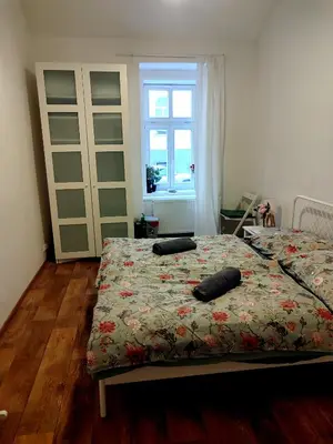 a bedroom with a bed with two pillows on it at Nice room with double bed in zizkov - shared bathroom in Prague