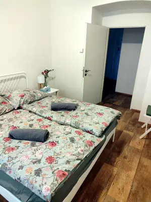 a bedroom with a bed with two pillows on it at Nice room with double bed in zizkov - shared bathroom in Prague
