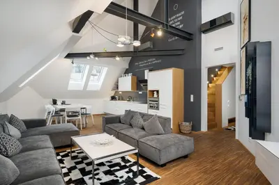 a living room with a couch and a table at MOOo Downtown in Prague