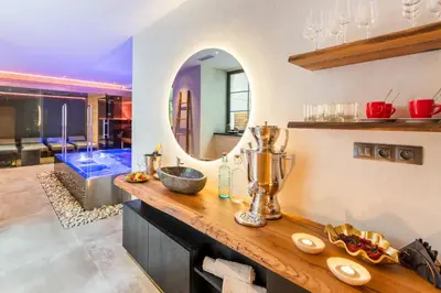 a bathroom with a sink and a mirror and a tub at MOOo Downtown in Prague