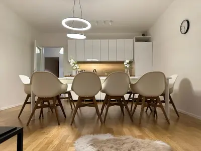 a dining room with a table and six chairs at Apartment 4 Room, 2 Bath, Parking in Prague