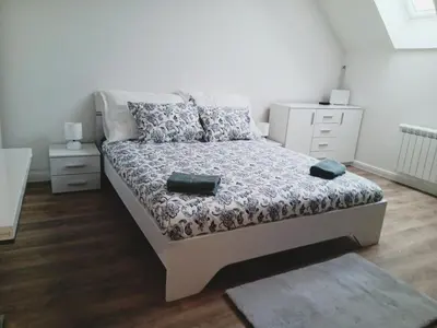 a bedroom with a bed and two night stands at Apartment Prague city center - next to Florenc in Prague