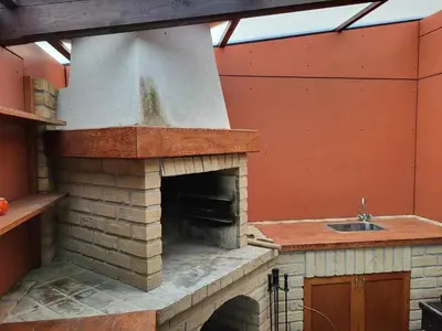 a brick oven with a sink in a kitchen at Ubytování na kopečku in Beroun