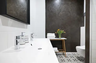 a bathroom with a white sink and a toilet at U Zlaté hvězdy Ritz in Litoměřice