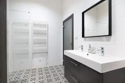 a white bathroom with a sink and a mirror at U Zlaté hvězdy Ritz in Litoměřice