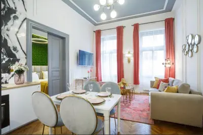 a living room with a table and chairs at Urban Premier Suite in Prague