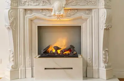 a white fireplace with a fire in it at Urban Presidential Suite in Prague