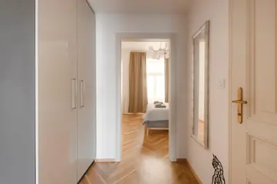 a hallway with a door leading to a bedroom at New Town Oases Apartment in Prague