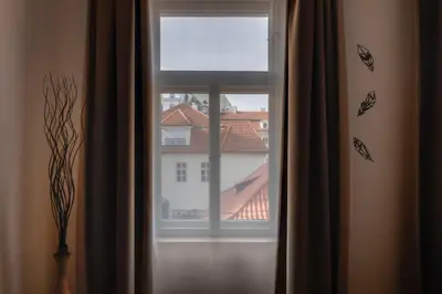 a window with a view of a building at New Town Oases Apartment in Prague