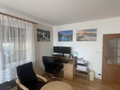 a room with a desk with a computer and two chairs at Holiday Home Vrbová Lhota U Aničky by Interhome in Vrbová Lhota