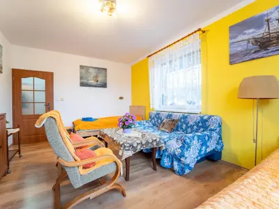 a living room with a couch and a table at Holiday Home Vrbová Lhota U Aničky by Interhome in Vrbová Lhota
