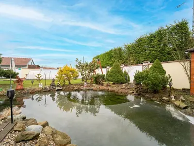 a garden with a pond in a yard at Holiday Home Vrbová Lhota U Aničky by Interhome in Vrbová Lhota