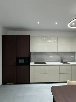 a kitchen with white cabinets and a black microwave at NEW Modern Large Apartment in New Town 3BDR in Prague