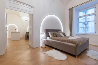 a bedroom with a bed with an arched doorway at Arch IV. in Prague