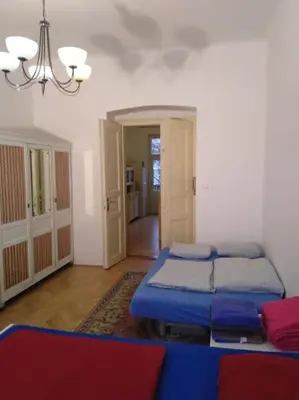 a living room with two beds and a couch at Authentic, traditional airbnb in central Prague ! in Prague