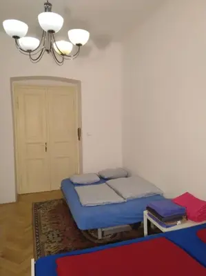 a room with a bed with blue pillows on it at Authentic, traditional airbnb in central Prague ! in Prague