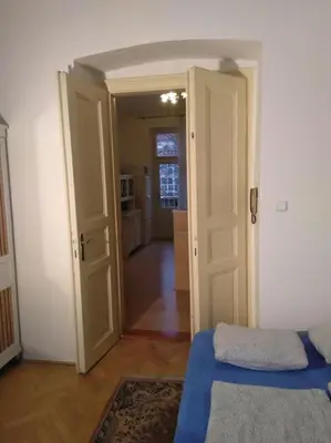 a room with a door open to a room with a kitchen at Authentic, traditional airbnb in central Prague ! in Prague