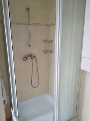 a shower in a bathroom with a glass door at Authentic, traditional airbnb in central Prague ! in Prague