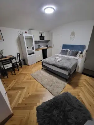 a bedroom with a bed and a table in it at Apartment Prague Center in Prague