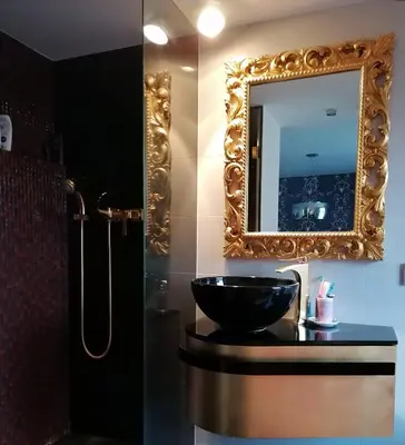 a bathroom with a sink and a mirror at Centrum luxury nice wiew, theras in Prague