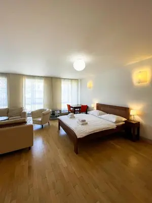 a large room with a bed and a couch at Havelska Old Town Residence in Prague
