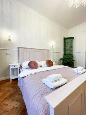 a large bed with two pillows on top of it at Stupartska - Premium Old Town Residence in Prague