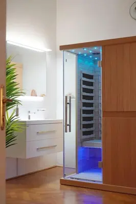a bathroom with a glass shower in a kitchen at NEW! Mucha 3BDR Flat in HEART of the City Center in Prague