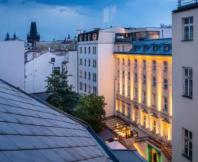 a lit up building in a city at night at 5BR+2Bath Old Town Loft Luxe Brickhouse, A/C in Prague