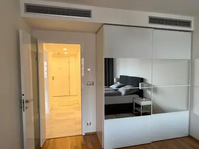 a room with a bed and a sliding glass door at Quiet apartment in the centre in Prague