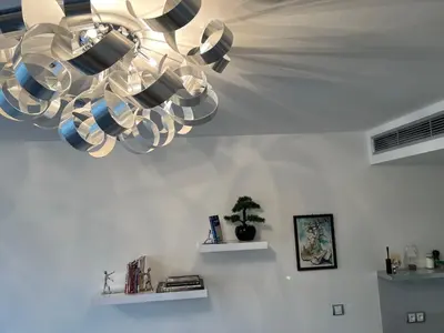 a chandelier hanging from a ceiling in a room at Quiet apartment in the centre in Prague