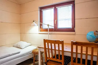 a room with a bed and a desk and a window at Houseboat Benjamin - Houseboats Benjamin & Franklin in Prague
