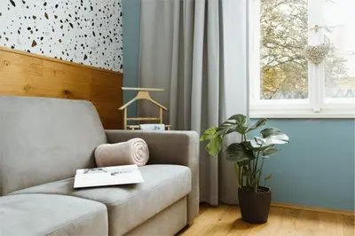 a living room with a couch and a window at Dream blue in city centreWenceslas Sq in walk in Prague
