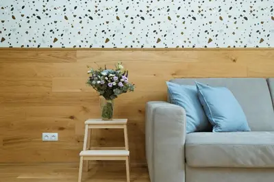 a living room with a couch and a table with a vase of flowers at Dream blue in city centreWenceslas Sq in walk in Prague