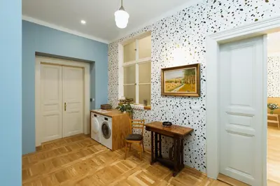 a laundry room with a washing machine and a table at Dream blue in city centreWenceslas Sq in walk in Prague