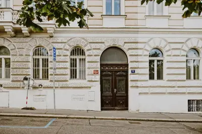 a white building with a black door on a street at Dream blue in city centreWenceslas Sq in walk in Prague