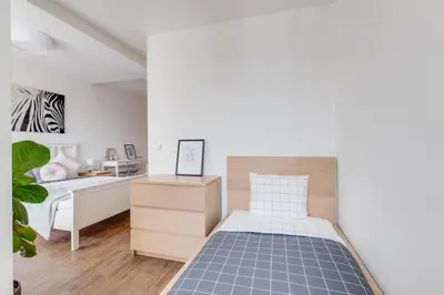 a bedroom with a bed and a desk at Central Cool Apt with terrace - Leg11 in Prague