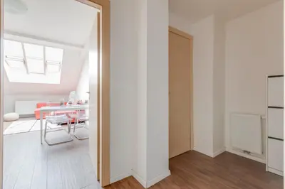 a dining room with a table and a mirror at Central Cool Apt with terrace - Leg11 in Prague