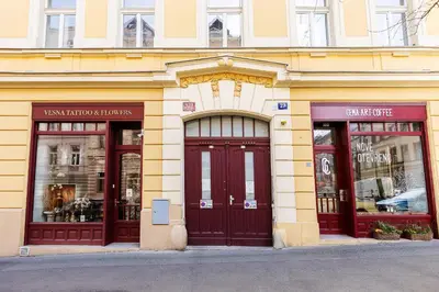 a store front with two doors and three windows at Modern Attic with Terrace - machova in Prague