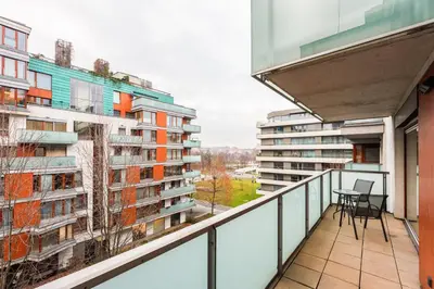 an apartment balcony with a view of buildings at Diamond River in Prague