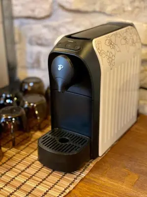 a black toaster sitting on top of a table at Historická chalupa Lhotky 1844 - soukromí a klid u Sázavy in Malotice