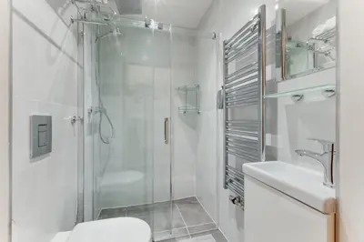 a bathroom with a shower and a toilet and a sink at Dream Apartments Prague in Prague