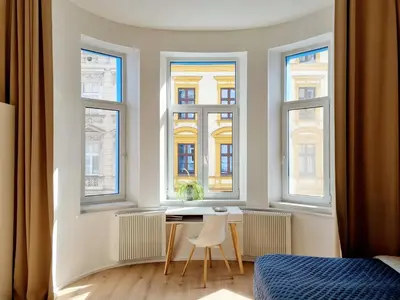 a bathroom with a washing machine and a sink at 7th Heaven Apartment close to metro and center in Prague