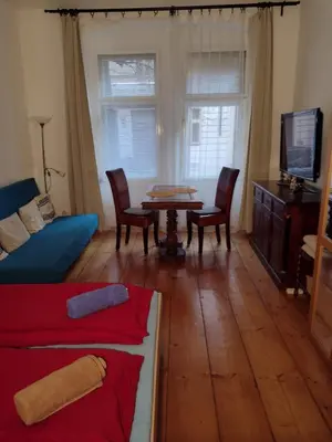 a living room with a couch and a table at Comfy home in Vinohrady in Prague