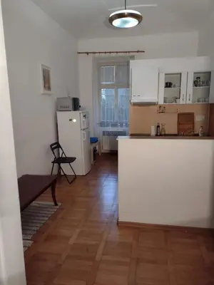 a kitchen with white cabinets and a white counter top at Comfy home in Vinohrady in Prague