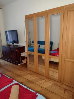 a bedroom with two bunk beds and a tv at Comfy home in Vinohrady in Prague