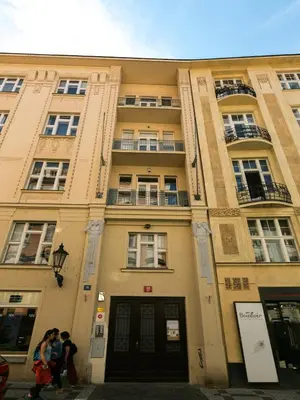 a group of people walking in front of a building at Old Town Residence by Little King in Prague