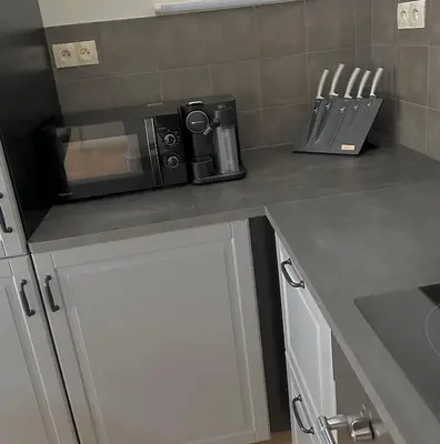 a kitchen with a counter top with a microwave at Byt ve městě Praha 2 in Prague