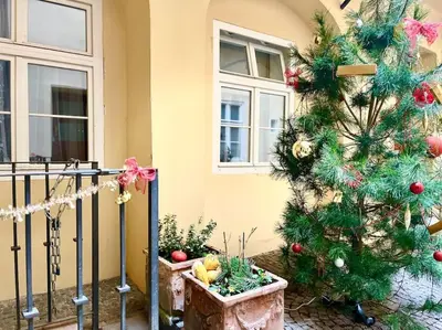 a set of stairs in a room with yellow walls at Old Town Prague Apartment in Prague