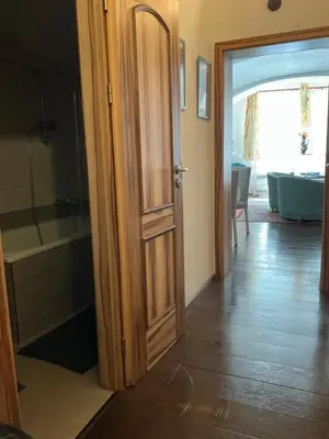 an open door to a bathroom with a bath tub at Apartmány na Náměstí in Český Brod
