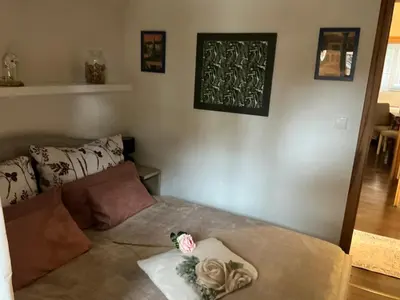 a living room with a couch with pillows on it at Apartmány na Náměstí in Český Brod